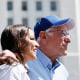 Sen. Bernie Sanders, I-Vt., and Rep. Alexandria Ocasio-Cortez, D-N.Y., look toward the crowd 